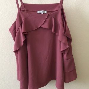 This is a pink off the shoulder ruffled top.